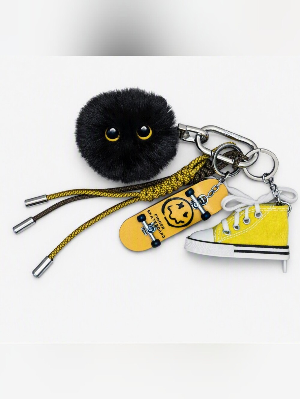 Stylish Black Pom Pom Keychain with Yellow Skateboard & Sneaker Charms